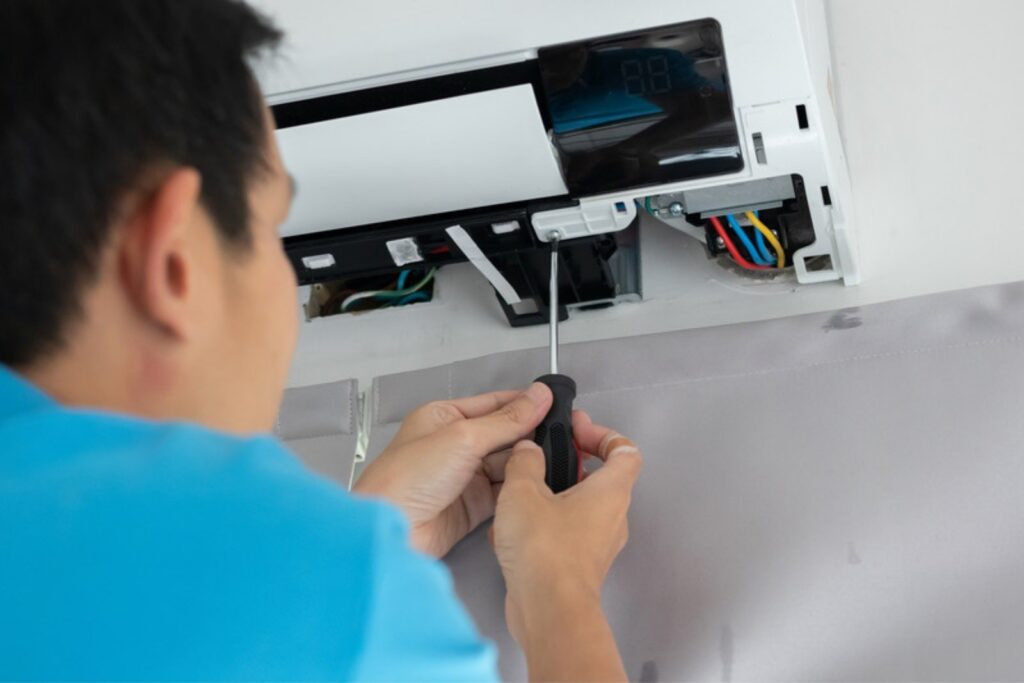 Technician repairing the indoor unit of a ductless mini-split